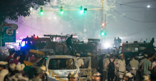 Investigating officers analyzing documents and evidence related to Delhi blast probe