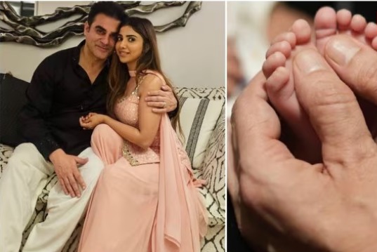 Arbaaz Khan and Sshura Khan holding their newborn daughter Sipaara during her first photo reveal.