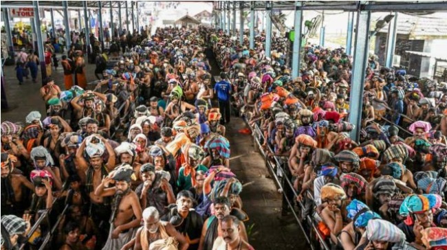 Sabarimala temple entrance with crowd management restrictions and pilgrim queue system.