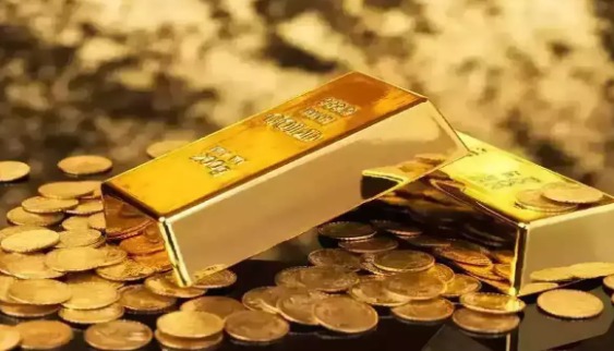 Gold bars and coins displayed with daily gold rate chart for India