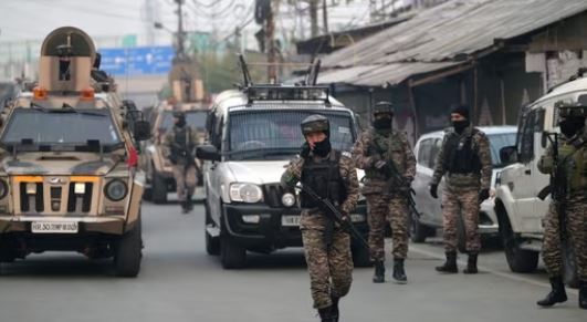 “Security personnel outside Kashmir Times office in Jammu during SIA raid”