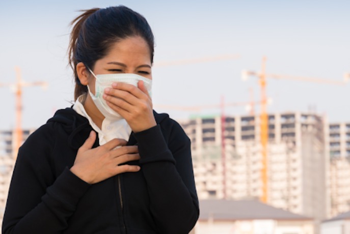 COPD patient struggling to breathe in winter smog