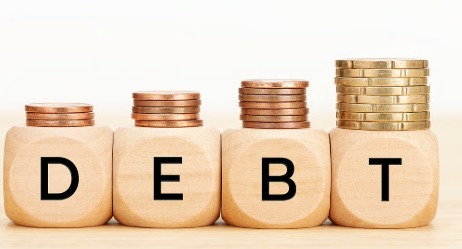 Indian family calculating EMIs as household debt rises faster than income