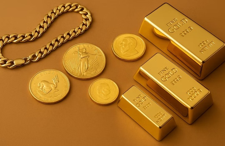 Gold coins and bars representing 24K, 22K, and 18K gold price today