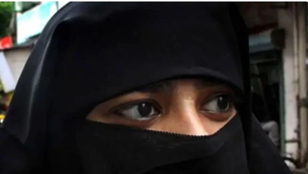 Australian senator wearing a burqa in Parliament during a controversial political protest