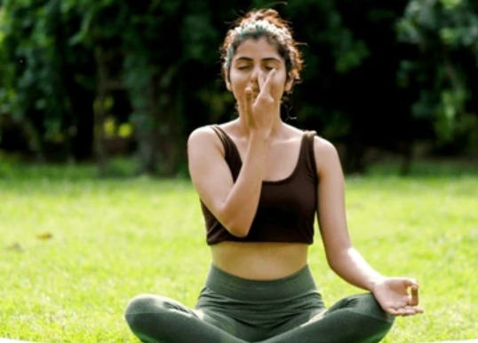 Fitness trainer teaching breathing exercises for improved oxygen flow