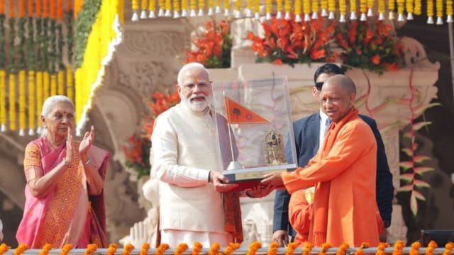 Prime Minister Narendra Modi hoisting the flag at Ayodhya Ram Mandir during a historic ceremony