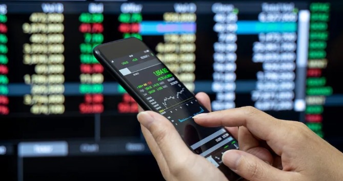 Stock market screen showing Tata Motors, Infosys, Kaynes Tech and renewable energy stocks