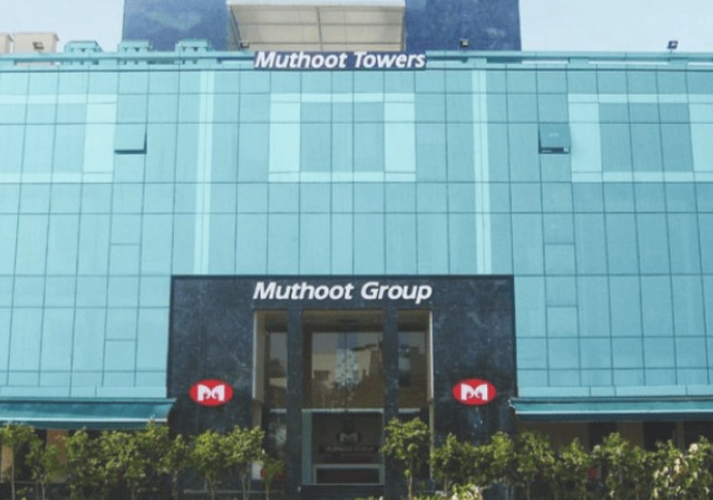 Muthoot Microfin office building with customers outside