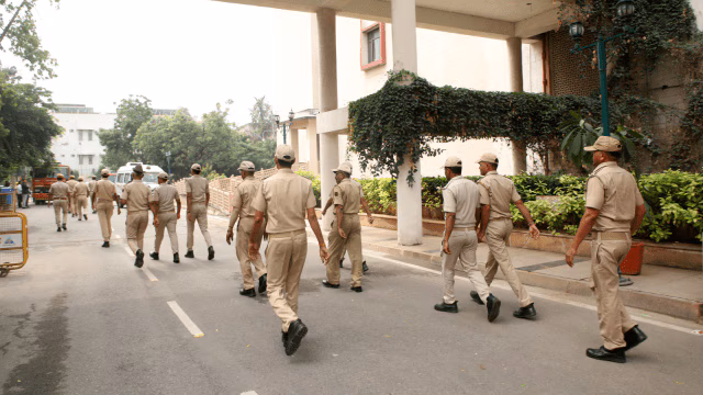 Police at crime scene investigating suitcase murder