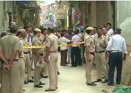 Delhi Police outside a residential home in South Delhi during investigation