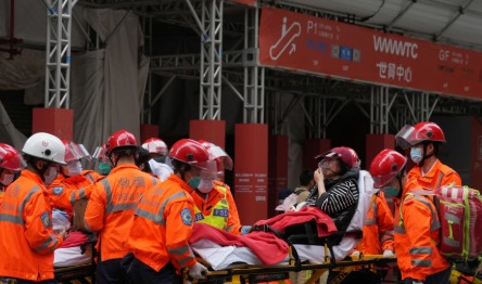 Firefighters using high-rise ladders to rescue residents from Hong Kong apartment fire