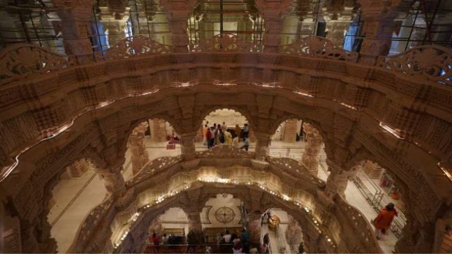 Inside the construction of the Ram Mandir in Ayodhya showing workers, stone architecture and large-scale temple development.