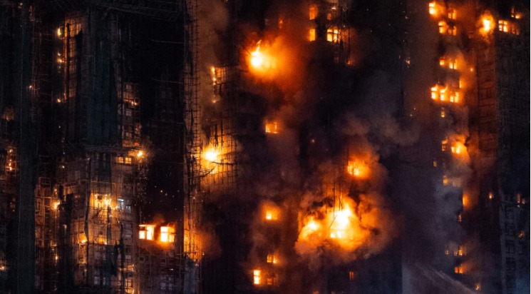Firefighters and rescue teams outside the high-rise Tai Po apartment building in Hong Kong after a deadly fire under SIT investigation.