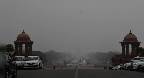 Supreme Court building New Delhi with smoggy Delhi skyline in background