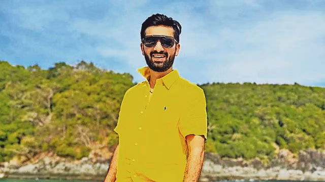 Cheteshwar Pujara standing in cricket stadium with a somber expression