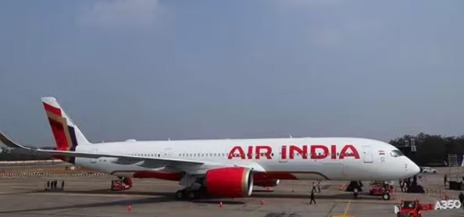 Air India aircraft on runway with emergency personnel nearby