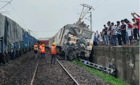 Railway track in Jharkhand with derailed train coaches and damaged overhead electric pole