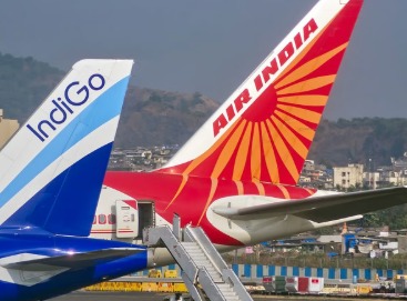 IndiGo and Air India Airbus A320 aircraft parked at airport facing temporary delays due to software upgrades.